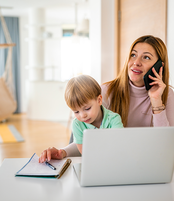 ShieldSafe Mom calling on the phone holding child